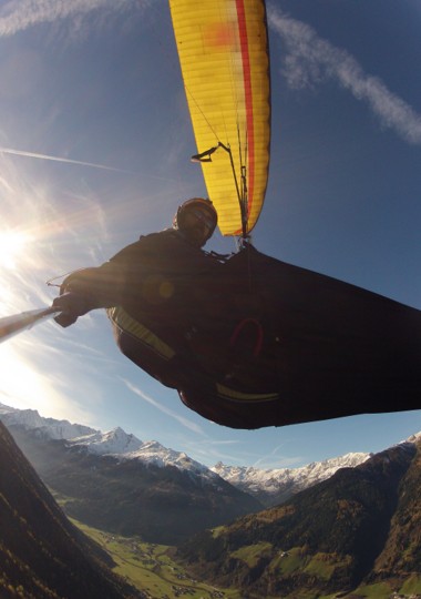 Andy Pag, Keynote speaker on sustainability, change and identity, flying a paraglider over the Himalays